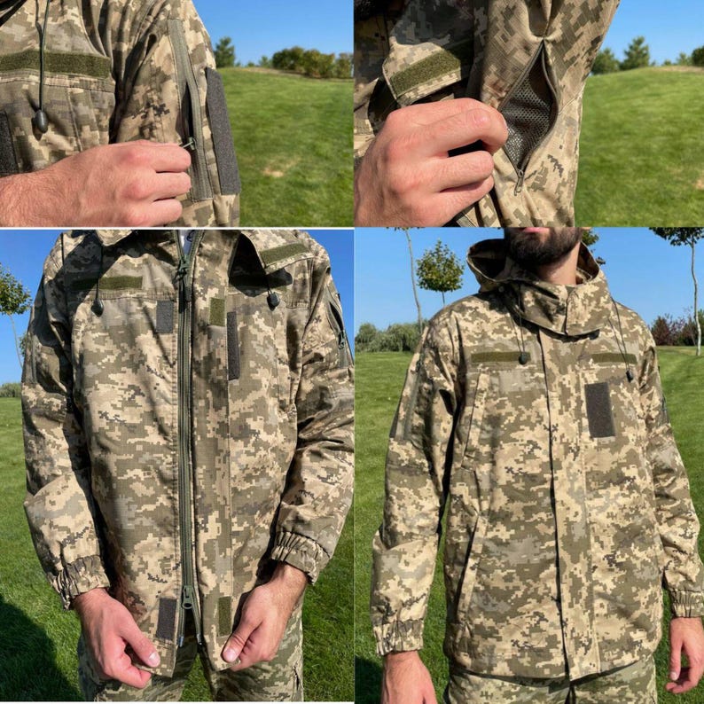 May include: A camouflage jacket in shades of green, brown, and tan. The jacket features a full-length zipper, multiple pockets, and a hood. Details include Velcro patches and zippered arm vents. The jacket is designed for outdoor wear.