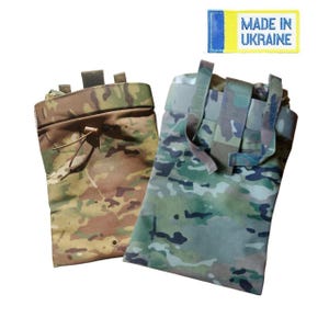 May include: Two camouflage pouches in shades of brown, green, and tan. One pouch has a drawstring closure, while the other has multiple straps. A yellow and blue tag with the text "MADE IN UKRAINE" is visible.