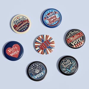 May include: A collection of seven round political buttons with various designs and text. The buttons feature phrases like "Voting prevents unwanted presidencies," "Protect Voting Rights," and "Votes for Women." Colors include red, white, blue, and black.