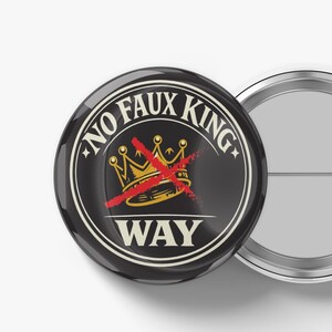 May include: A black button with the words "NO FAUX KING WAY" in a white circular design. A gold crown with a red slash through it is in the center. The button is round and has a metal back.
