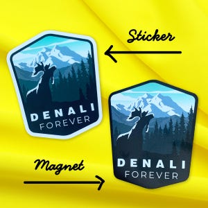 May include: Two versions of a sticker and magnet featuring a mountain range with a moose silhouette and the text "DENALI FOREVER". The sticker is white with blue and black accents. The magnet is black with blue and white accents.