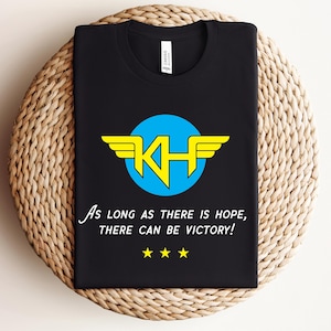 希望がある限り勝利はある、ワンダーウーマンにインスパイアされたスーパーヒーローTシャツ | ヒロイックTシャツ | ハリス・ウォルツ 2024 民主党