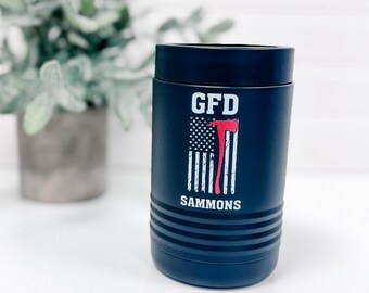 May include: A black insulated can cooler with a white American flag design and the text "GFD SAMMONS" and "GFD" printed on it.