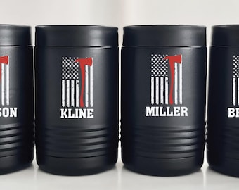 May include: Four black insulated tumblers with a white American flag and red axe graphic. Each tumbler has a different name printed on it: Kline, Miller, Benson, and Brown.