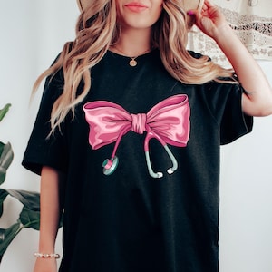 Coquette Nurse Stethoscope Bow Sweatshirt, Gift for Nurse, Bow Oversized Shirt, Nurse Appreciation, Valentine&#39;s Day Gift for Nurse, Pink Bow