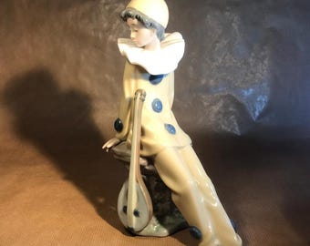 Timeless Elegance and Playful Charm Vintage 1987 LLADRO NAO Yellow Clown with Mandolin  The Wandering Minstrel