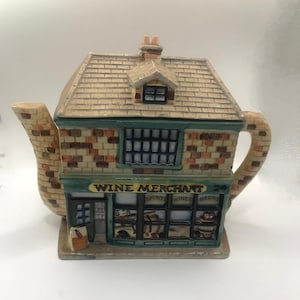 The Whimsical Wine Merchant – Vintage Village Collection Teapot by Annie Rowe