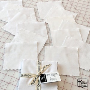 Precut bundle 5 inch charm pack fabric stacker includes 42 pieces. Cotton fabric charm pack from Maywood Studio. This cute white on white charm pack has hearts, stars, swirls, flowers and so much more. Great fabric bundle for quilters and crafters.