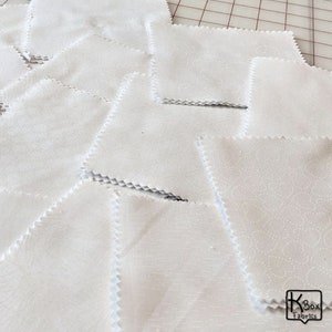 Precut bundle 5 inch charm pack fabric stacker includes 42 pieces. Cotton fabric charm pack from Maywood Studio. This cute white on white charm pack has hearts, stars, swirls, flowers and so much more. Great fabric bundle for quilters and crafters.
