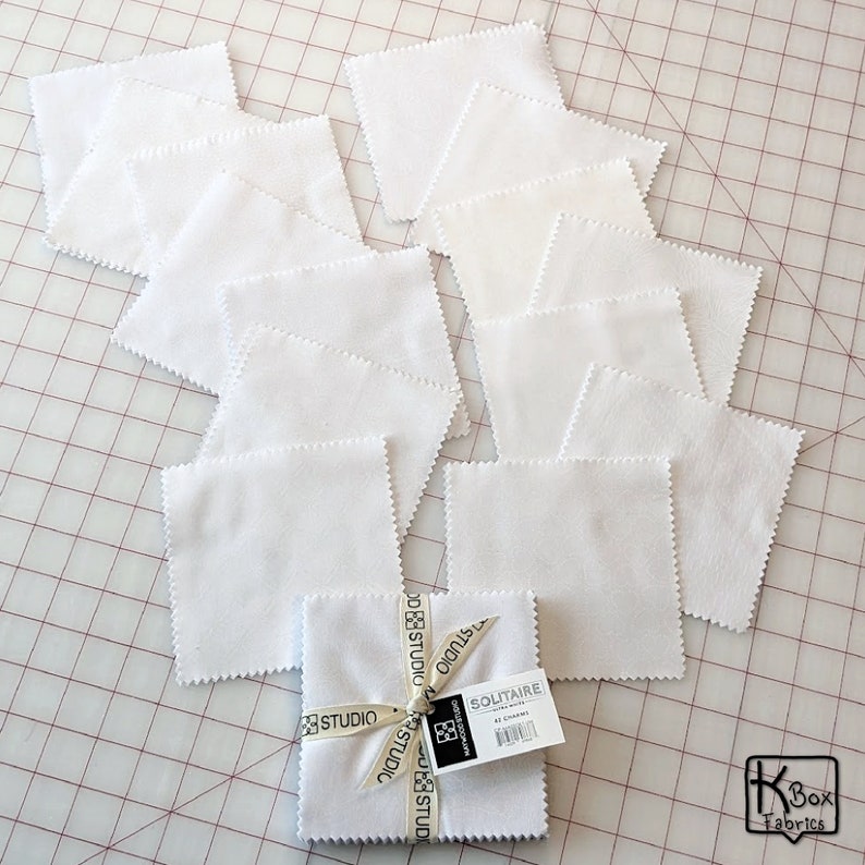 Precut bundle 5 inch charm pack fabric stacker includes 42 pieces. Cotton fabric charm pack from Maywood Studio. This cute white on white charm pack has hearts, stars, swirls, flowers and so much more. Great fabric bundle for quilters and crafters.
