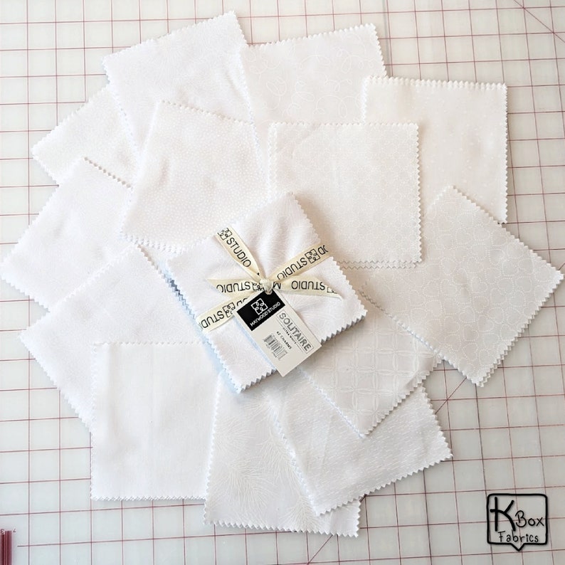 Precut bundle 5 inch charm pack fabric stacker includes 42 pieces. Cotton fabric charm pack from Maywood Studio. This cute white on white charm pack has hearts, stars, swirls, flowers and so much more. Great fabric bundle for quilters and crafters.
