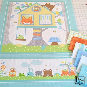 May include: A fabric panel featuring a whimsical forest scene with a treehouse, animals, and a blue border. The treehouse has a yellow roof and windows with a fox, rabbit, and owl. A frog swings below. Additional fabric swatches are included.