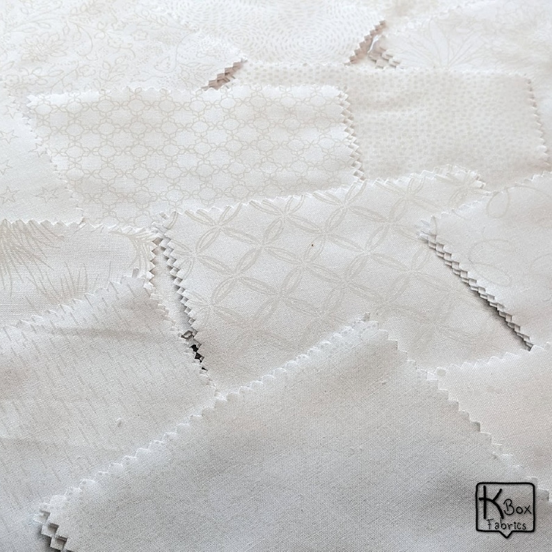 Precut bundle 5 inch charm pack fabric stacker includes 42 pieces. Cotton fabric charm pack from Maywood Studio. This cute white on white charm pack has hearts, stars, swirls, flowers and so much more. Great fabric bundle for quilters and crafters.