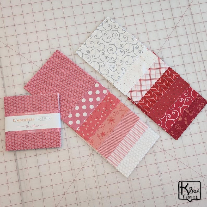Precut bundle 5" charm pack fabric stacker includes 42 square 5" x 5" pieces. Kimberbell Basics The Be Mine line from Maywood Studio. Red, Pink and White quality quilting cotton fabric charm pack. Precut quilting cotton squares great blenders for quilting and embroidering. Great fabric bundle for quilters and crafters.