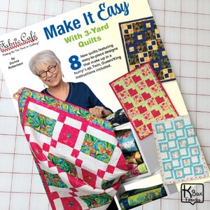 May include: A book titled "Make It Easy With 3-Yard Quilts" by Donna Robertson. The cover features a woman holding a quilt with a pink and white geometric design. The book showcases 8 new easy-to-piece quilt designs.
