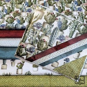 May include: A collection of fabric samples featuring a cactus and succulent design. The fabrics display various patterns, including a repeating cactus print, geometric designs, and solid colors in red, blue, and green. The image showcases a variety of textures and patterns.