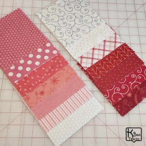 Precut bundle 5" charm pack fabric stacker includes 42 square 5" x 5" pieces. Kimberbell Basics The Be Mine line from Maywood Studio. Red, Pink and White quality quilting cotton fabric charm pack. Precut quilting cotton squares great blenders for quilting and embroidering. Great fabric bundle for quilters and crafters.