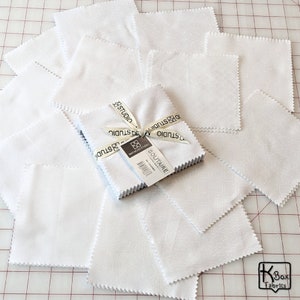 Precut bundle 5 inch charm pack fabric stacker includes 42 pieces. Cotton fabric charm pack from Maywood Studio. This cute white on white charm pack has hearts, stars, swirls, flowers and so much more. Great fabric bundle for quilters and crafters.