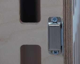 Serrure pour les commandes de caisses pour chiens.