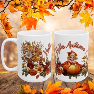 May include: Two white ceramic mugs with autumn-themed designs. One mug features a floral arrangement with the word "Hello" and the other mug features a girl holding a pumpkin with the text "Hello Autumn!"