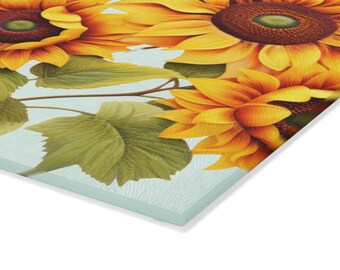 May include: A close-up of a bouquet of yellow sunflowers with green leaves against a light blue background.