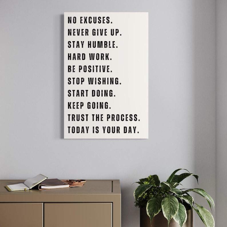 Minimalist white motivational wall art print with the phrases No Excuses, Never Give Up, Stay Humble, Trust the Process – Inspirational decor for home office, gym, or study space.