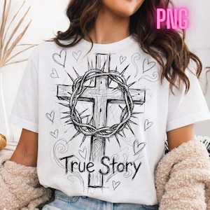 Peut inclure: T-shirt blanc avec un dessin noir et blanc d'une croix, d'une couronne d'épines, de coeurs et le texte "True Story". Le design est de style dessiné à la main.
