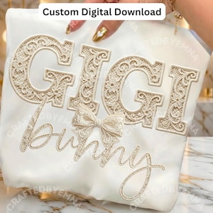 Peut inclure: Tissu crème avec les mots "GIGI Bunny" brodés dans une police délicate en forme de dentelle. Un nœud est centré sous le nom. Le texte "Custom Digital Download" est en haut.