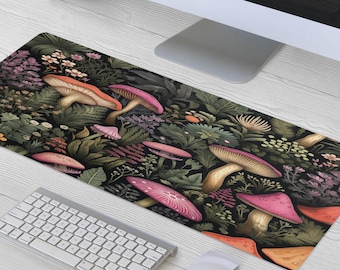 May include: A black and green mouse mat with a colourful mushroom and flower design. The design features pink, orange, and yellow mushrooms with green leaves and flowers.