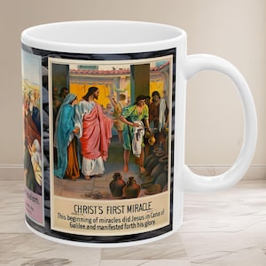 May include: A white ceramic mug with a colorful image of Jesus performing his first miracle, turning water into wine. The image is surrounded by a black border and the text "CHRIST'S FIRST MIRACLE" is printed below the image. The text reads "This beginning of miracles did Jesus in Cana of Galilee and manifested forth his glory."