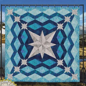 May include: A quilt design titled "Peace After the Storm" with a geometric pattern in shades of blue and white. The quilt features a large central star and smaller stars. The text "QuiltFOX Design" and "Tested Pattern" are also visible.