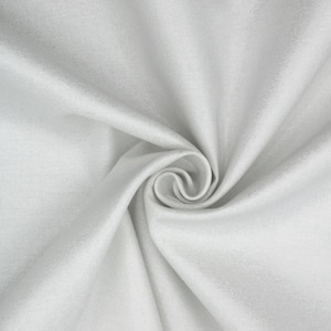 May include: Close-up of a white fabric with a soft texture, arranged in a spiral pattern. The fabric appears to be a light, neutral color, with subtle variations in tone due to the folds and shadows. The overall effect is smooth and flowing.