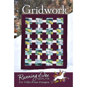 May include: A quilt pattern titled Gridwork by Running Doe Quilts for Villa Rosa Designs. The quilt features a dark purple background with a grid of white sashing separating square blocks that display a landscape print with trees and hills.