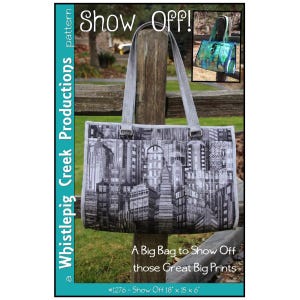 May include: A sewing pattern titled Show Off by Whistlepig Creek Productions for a tote bag. The cover features a black and white city skyline print bag with two straps, and an inset photo of a blue and green version. Dimensions are 18 x 15 x 6 inches.