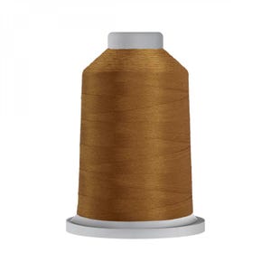 May include: A spool of brown thread on a white bobbin.