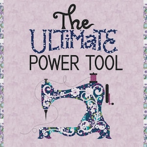 May include: A decorative sewing-themed print with the text "The Ultimate Power Tool." The image features a sewing machine with floral patterns in shades of blue, white, and purple. The background is a light purple with a floral border.