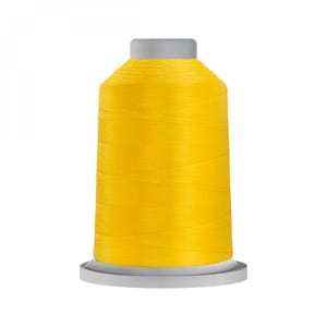 May include: A spool of bright yellow thread for sewing or embroidery.