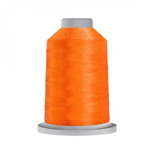 May include: A spool of bright orange thread on a white bobbin.