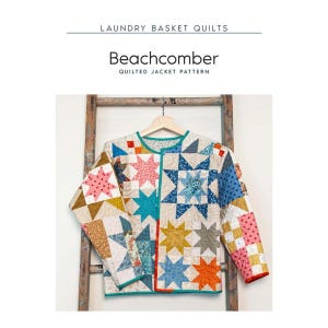 May include: A quilted jacket pattern titled Beachcomber by Laundry Basket Quilts. The jacket features a patchwork design with various star motifs in shades of blue, pink, orange, and yellow on a cream background, finished with teal trim.