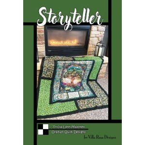May include: A quilt pattern titled Storyteller by Tricia Lynn Maloney for Orphan Quilt Designs and Villa Rosa Designs. The cover features a patchwork quilt with a central panel depicting a tree, surrounded by green and patterned fabric blocks.