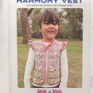 May include: A children's reversible patchwork vest with a floral pattern, pink trim, and a bow. The vest is worn by a smiling child. The text "HARMONY VEST" and "Melly and Me" are visible.