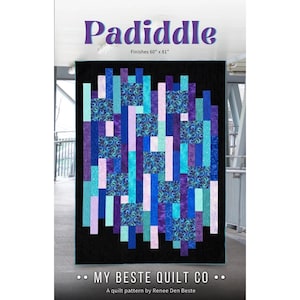 May include: A quilt pattern titled Padiddle by My Beste Quilt Co. The design features a vertical arrangement of rectangular fabric strips in shades of purple, blue, and teal against a black background. The finished size is 60 inches by 81 inches.