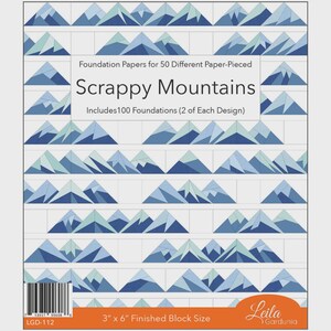 May include: A package of "Scrappy Mountains" foundation papers for paper-piecing. The design features a repeating pattern of blue and teal mountain shapes. The package includes 100 foundations, with a finished block size of 3" x 6".