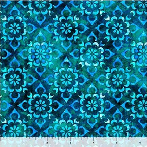 May include: A teal and blue patterned fabric with a repeating floral design. The fabric has a watercolour effect and a slightly textured surface.