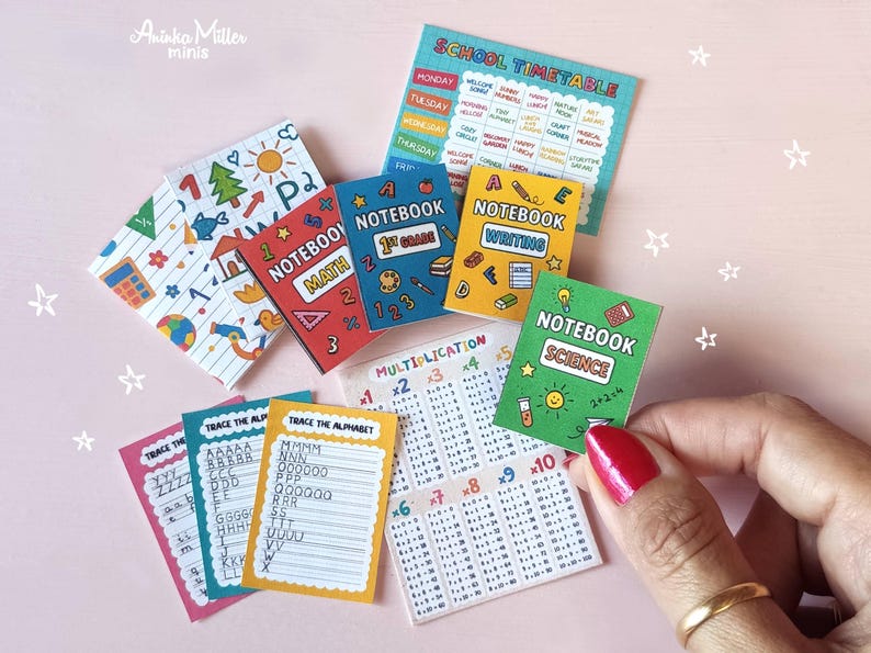 Miniature school supplies set including tiny notebooks for math, science, writing, alphabet tracing sheets, multiplication tables, and a colorful school timetable, handmade dollhouse mini stationery by Aninka Miller Minis