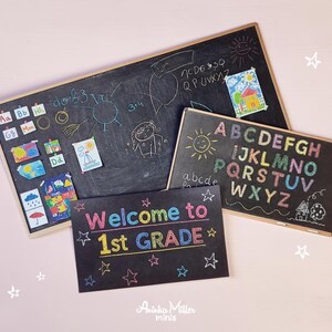 Miniature classroom chalkboards with colorful alphabet letters, drawings, and 'Welcome to 1st Grade' sign, perfect for dollhouse school scenes, teacher gifts, or educational crafts, displayed on a light pink background. By Aninka Miller Minis