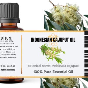 May include: A 10 ml amber glass bottle of Indonesian Cajuput Oil with a black cap. The label features the text INDONESIAN CAJUPUT OIL, 100% Pure Essential Oil, botanical name: Melaleuca cajuputi, and caution instructions with a 0.34 fl. oz volume.