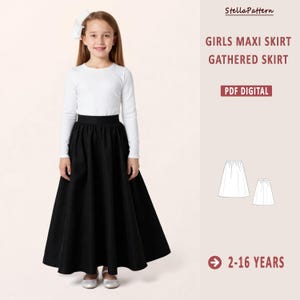 May include: A girl in a white long-sleeved top and a black maxi skirt. The image includes text that reads "GIRLS MAXI SKIRT GATHERED SKIRT PDF DIGITAL" and "2-16 YEARS". A white bow is in the girl's hair.