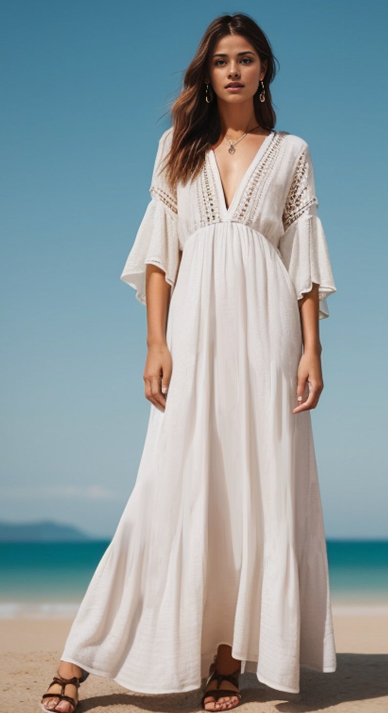 Puede incluir: Un vestido maxi blanco con escote en V y detalles de crochet. El vestido tiene una silueta fluida y es perfecto para una boda en la playa o una fiesta de verano.