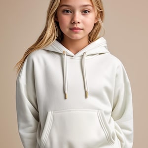 May include: A white hooded sweatshirt with a kangaroo pocket and gold drawstring ties.